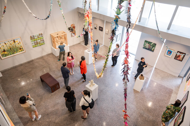 view of guests in AACC CADE Gallery from above