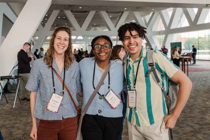 refed conference guests pose for photo