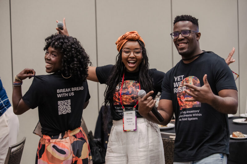 refed team poses for photo showing their shirts