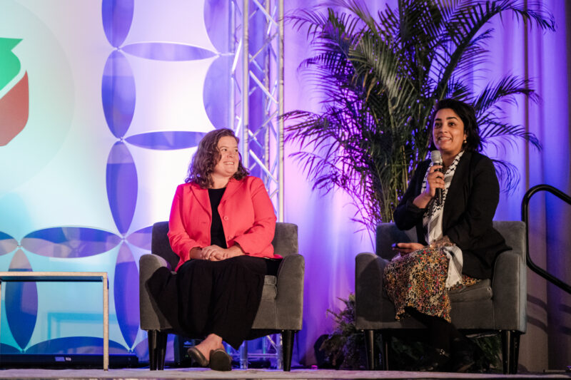 refed conference speakers on a stage for a panel