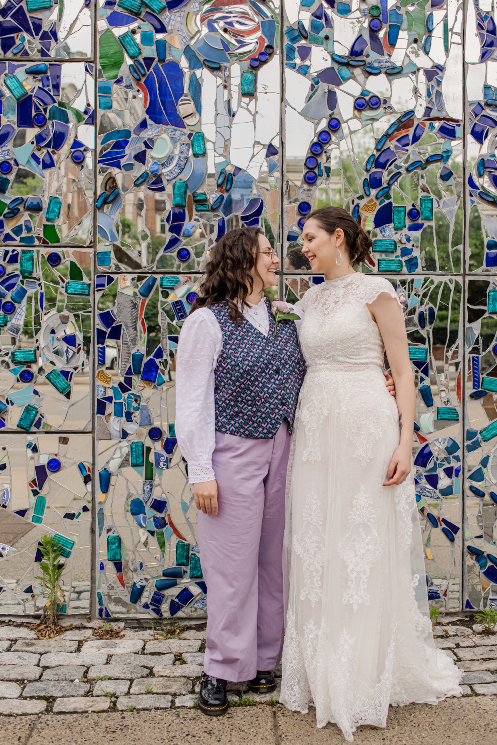 wedding couple in front of AVAM mosaic wall