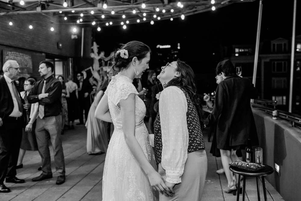 black and white photo of couple dancing on wedding day