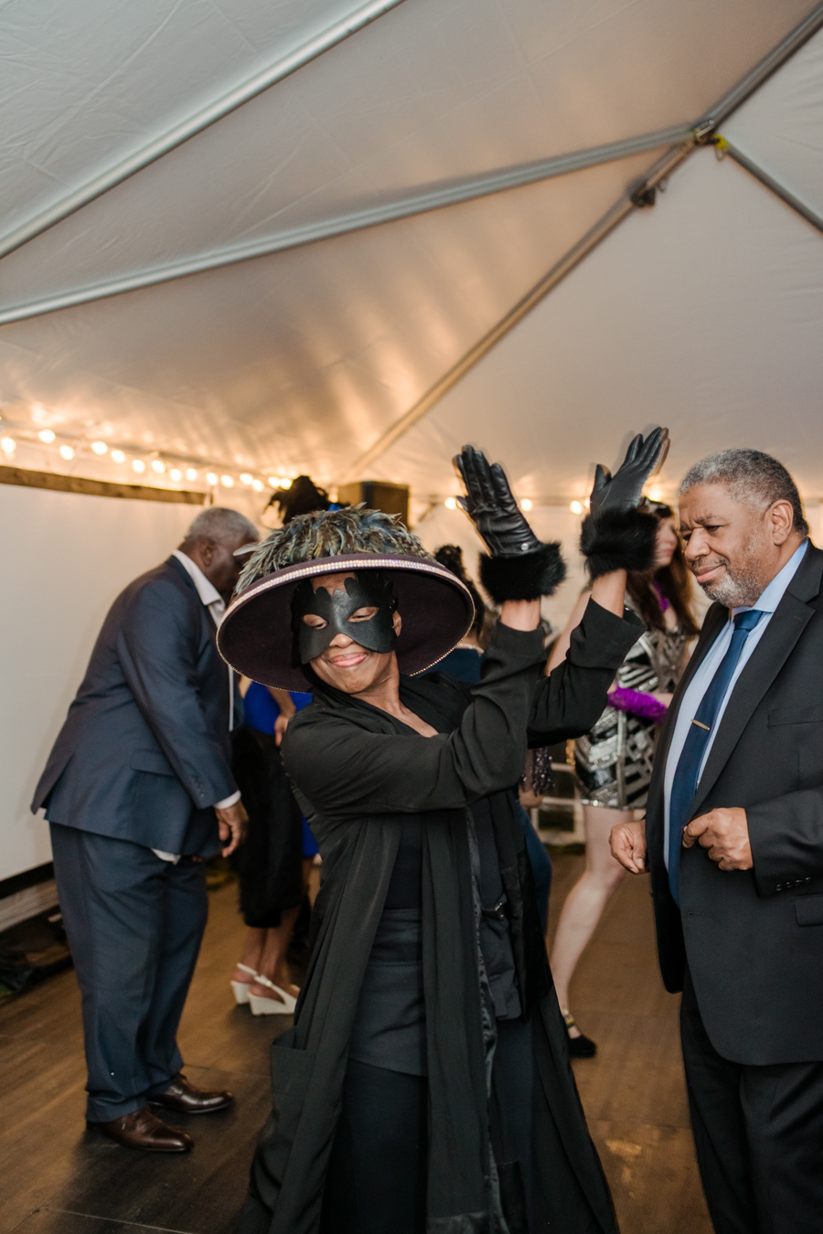 guests dance at SFNC 60th gala wearing masquerade attire