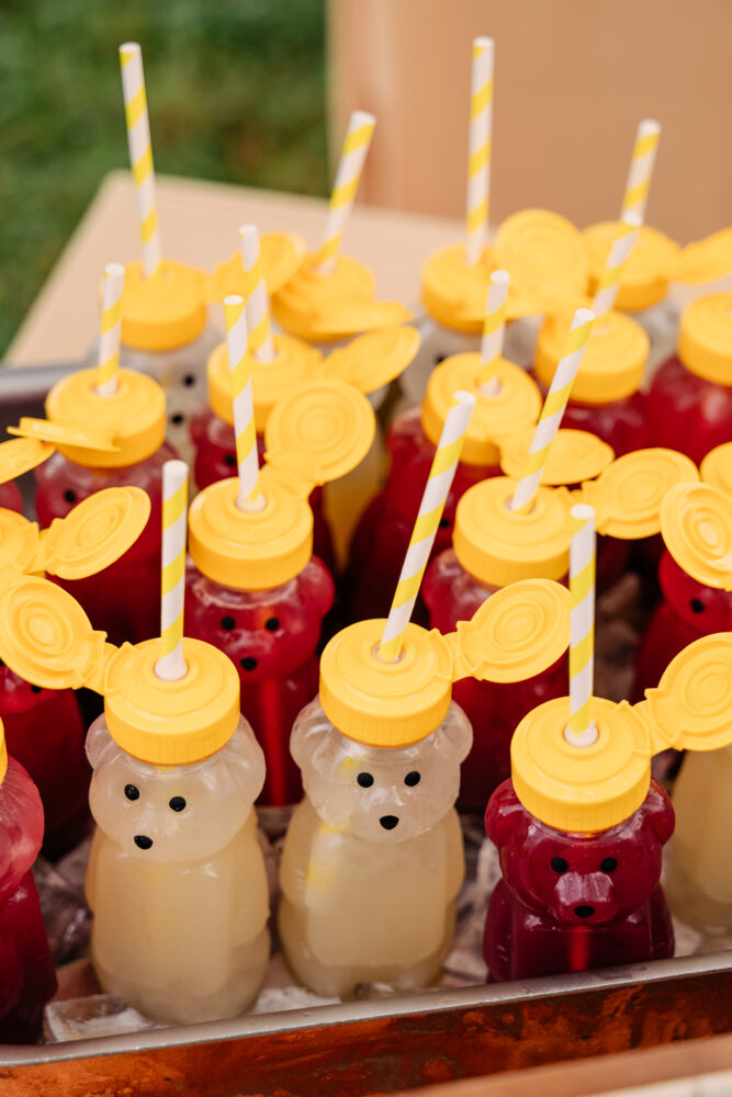 honey bear containers filled with cocktails