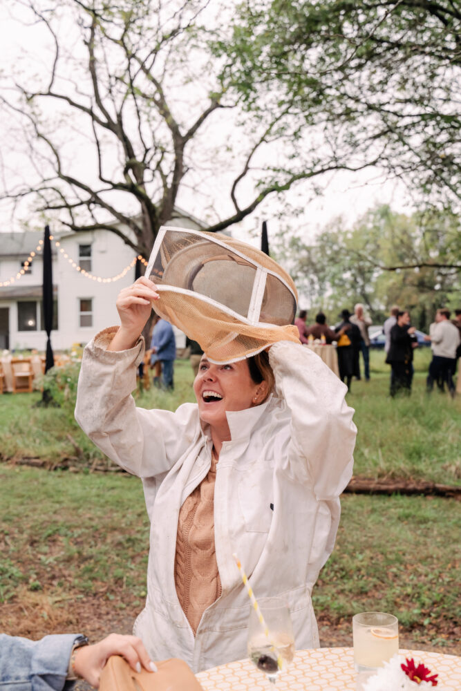 guest putting on bee suit