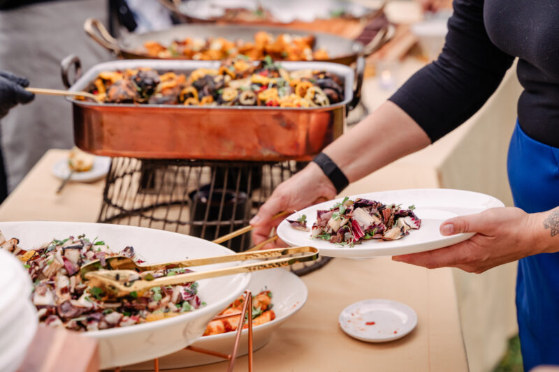 guests plating food from honey harvest buffet