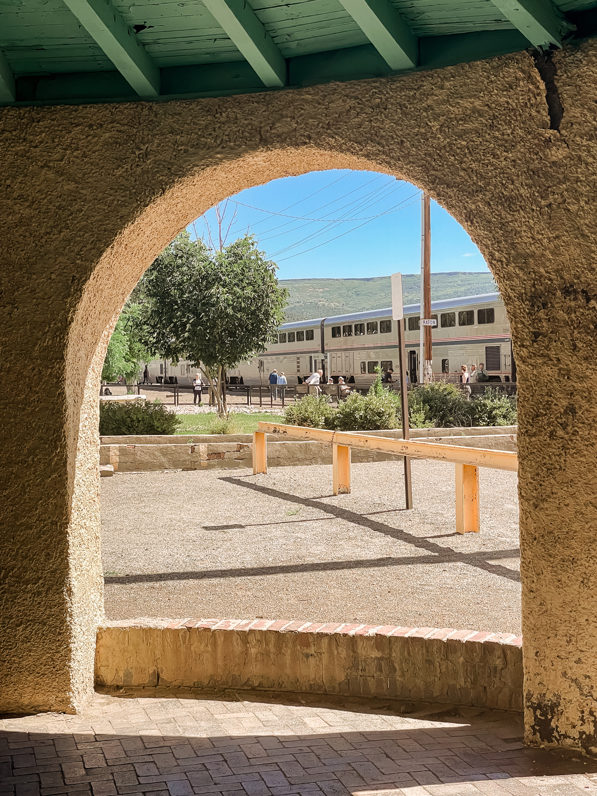arched structure with train in distance
