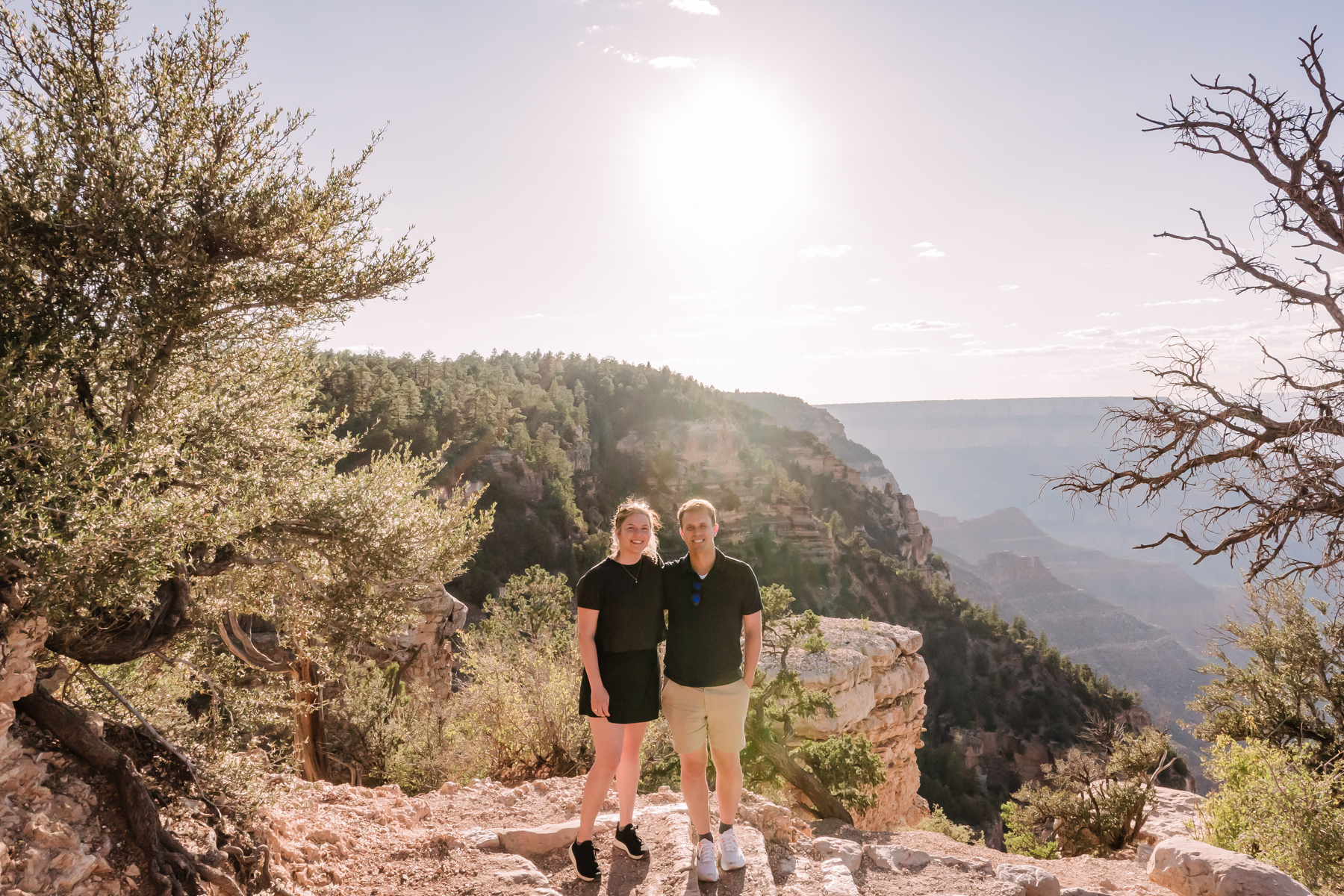 couple posing in front of grand canyon