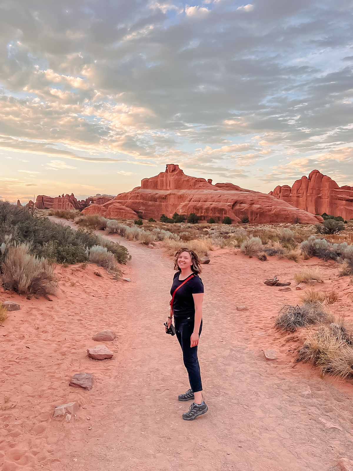 woman posing in desert at arches national park