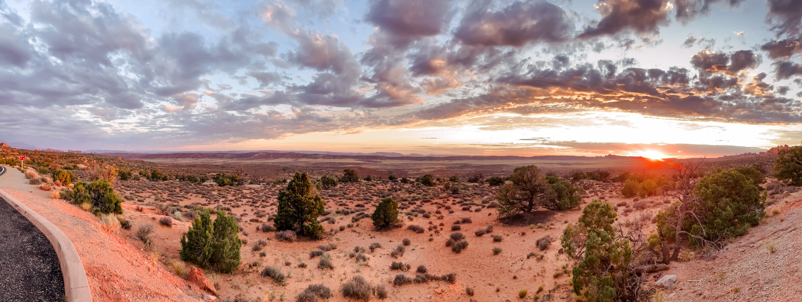 panorama of sunset over desert area at arches national park