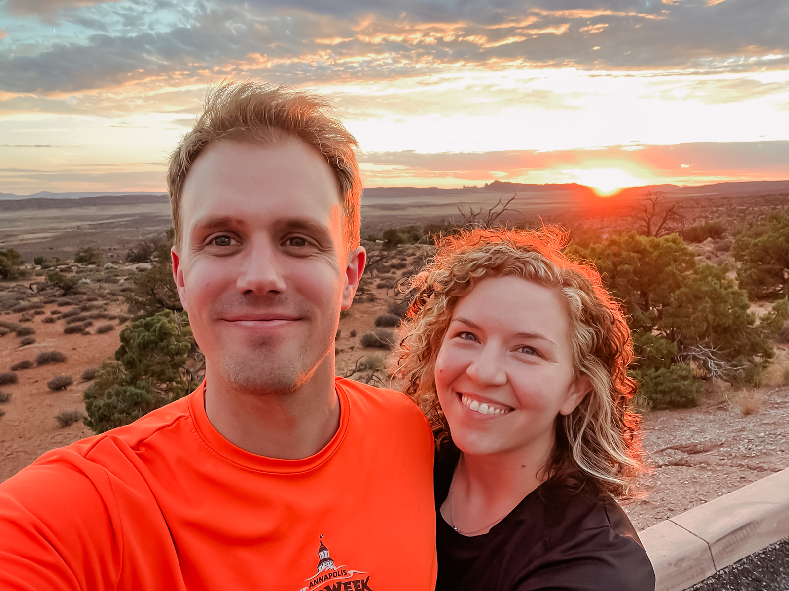 couple's selfie at arches national park at sunset