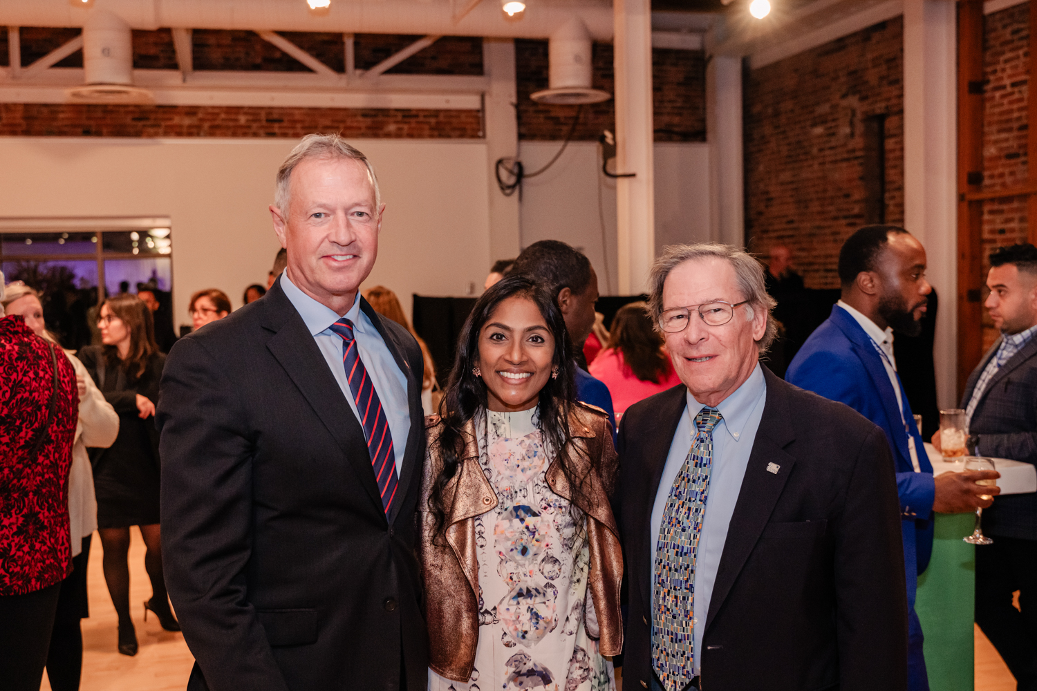 VIPs including Martin O'Malley and Global Refuge's Krish O'Mara pose for a photo