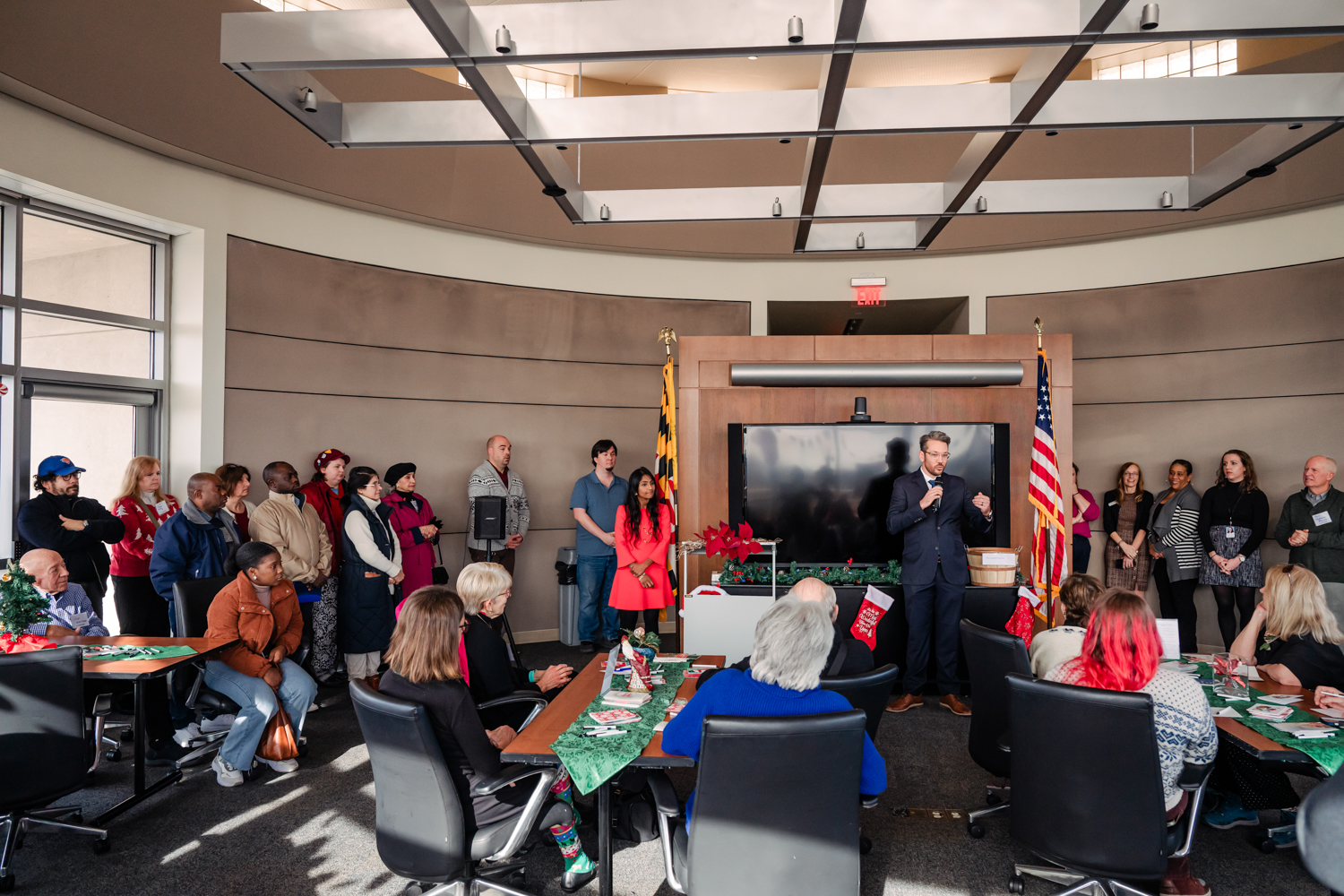 Wide shot of guests in a room at Global Refuge's Baltimore headquarters