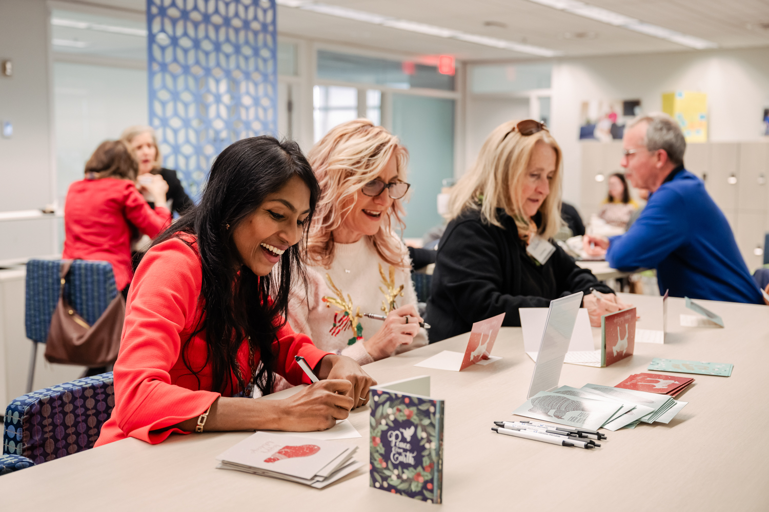 Krish O'Mara and guests write cards for Hope for the Holidays