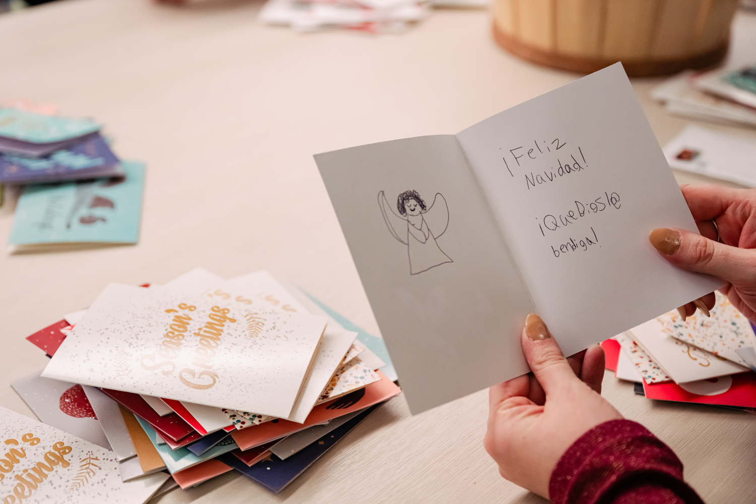 close up of open holiday card with handwritten message