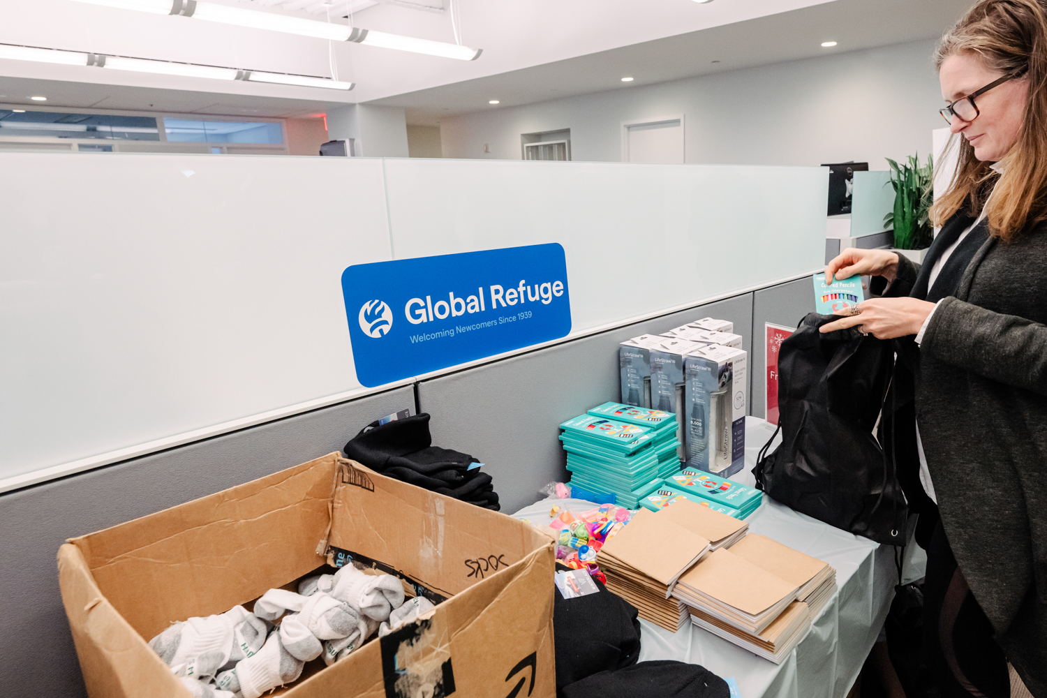 a guest at Global Refuge packs a care bag