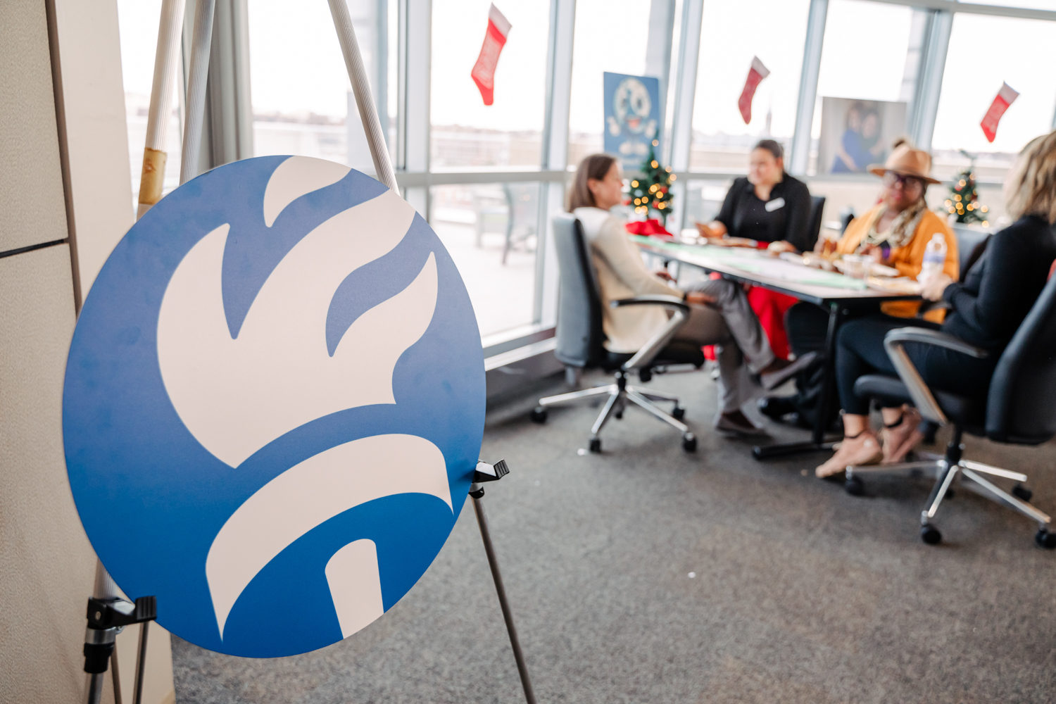 Global Refuge logo on a sign at Hope for the Holidays event