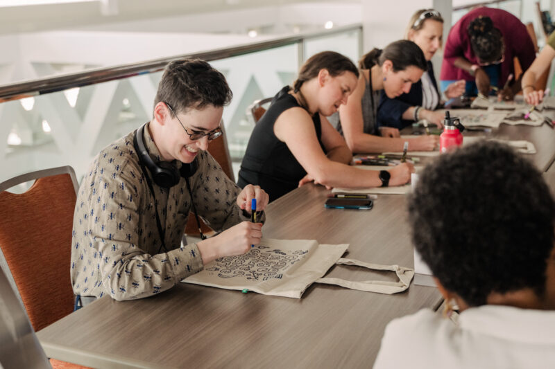 conference guests decorating their swag bags