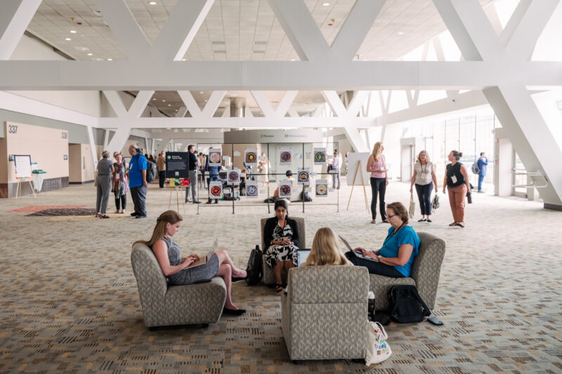 refed conference guests sitting in lounge area