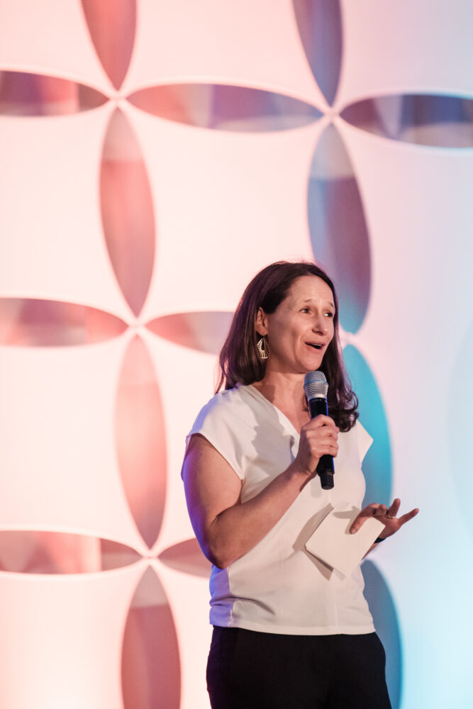 Refed President Dana Gunders addresses conference guests